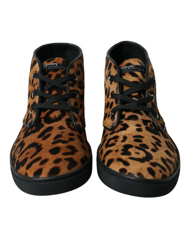 Brown leopard print pony hair leather sneakers by Dolce & Gabbana with white rubber soles and laces.