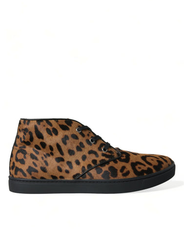 Brown leopard print pony hair leather sneakers by Dolce & Gabbana with white rubber soles and lace-up design.