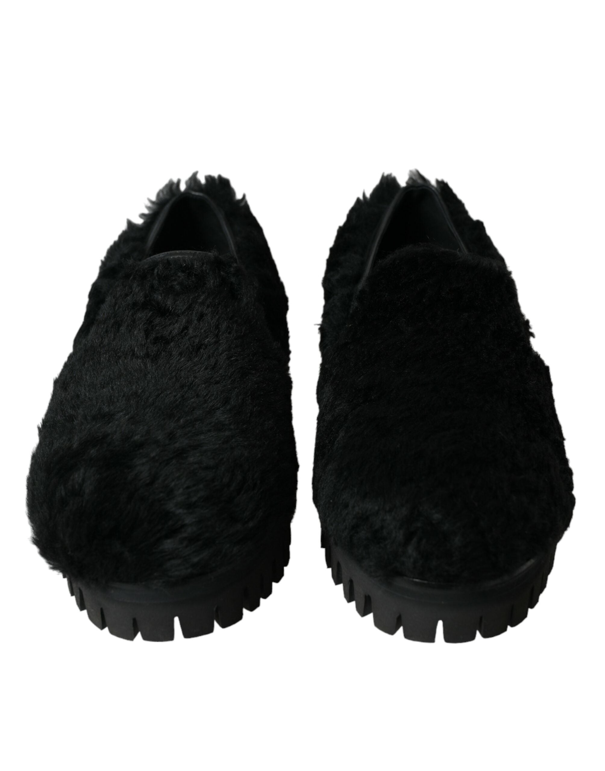 Black fur leather slippers dress shoes by Dolce & Gabbana with sleek design and luxurious texture.