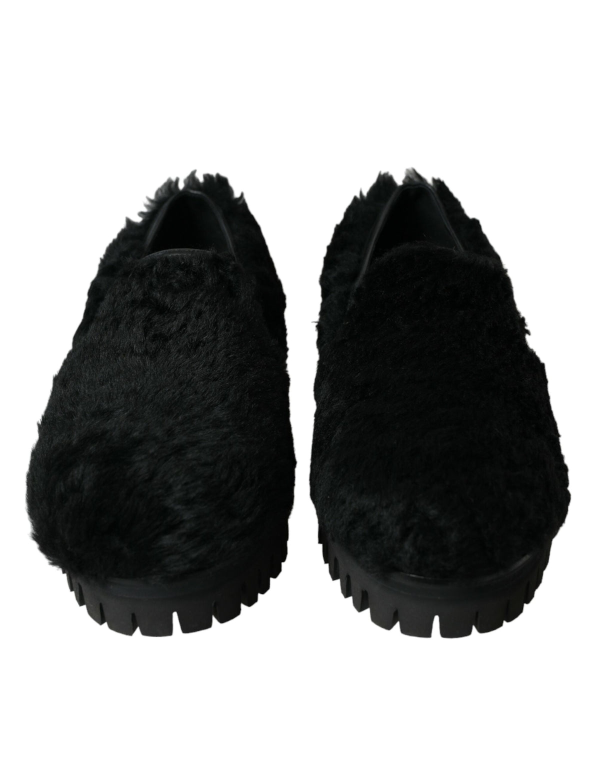 Black fur leather slippers dress shoes by Dolce & Gabbana with sleek design and luxurious texture.