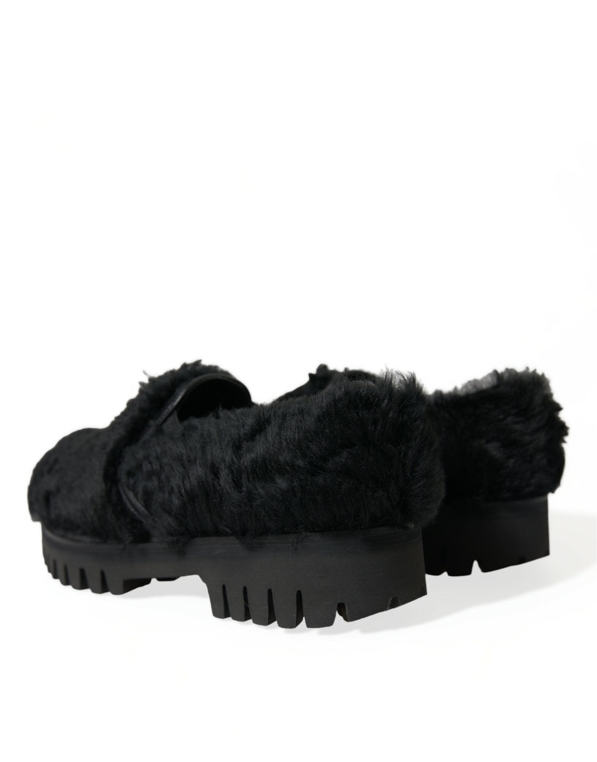 Black fur leather slippers dress shoes by Dolce & Gabbana showing a sleek, stylish design with fur accents and leather finish.