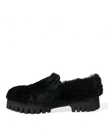 Black fur leather slippers dress shoes by Dolce & Gabbana, featuring a sleek design with luxurious fur accents and smooth leather finish.
