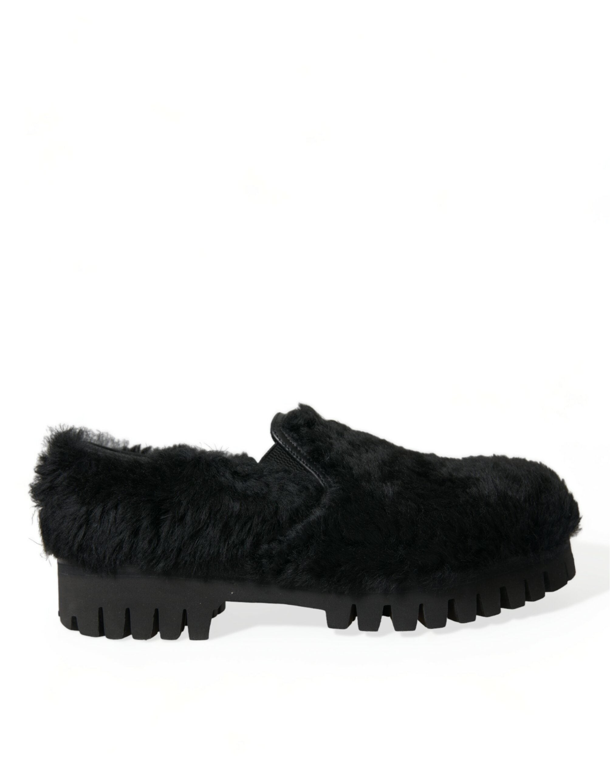 Black fur leather slippers dress shoes by Dolce & Gabbana, featuring a sleek design with plush fur accents and leather detailing.