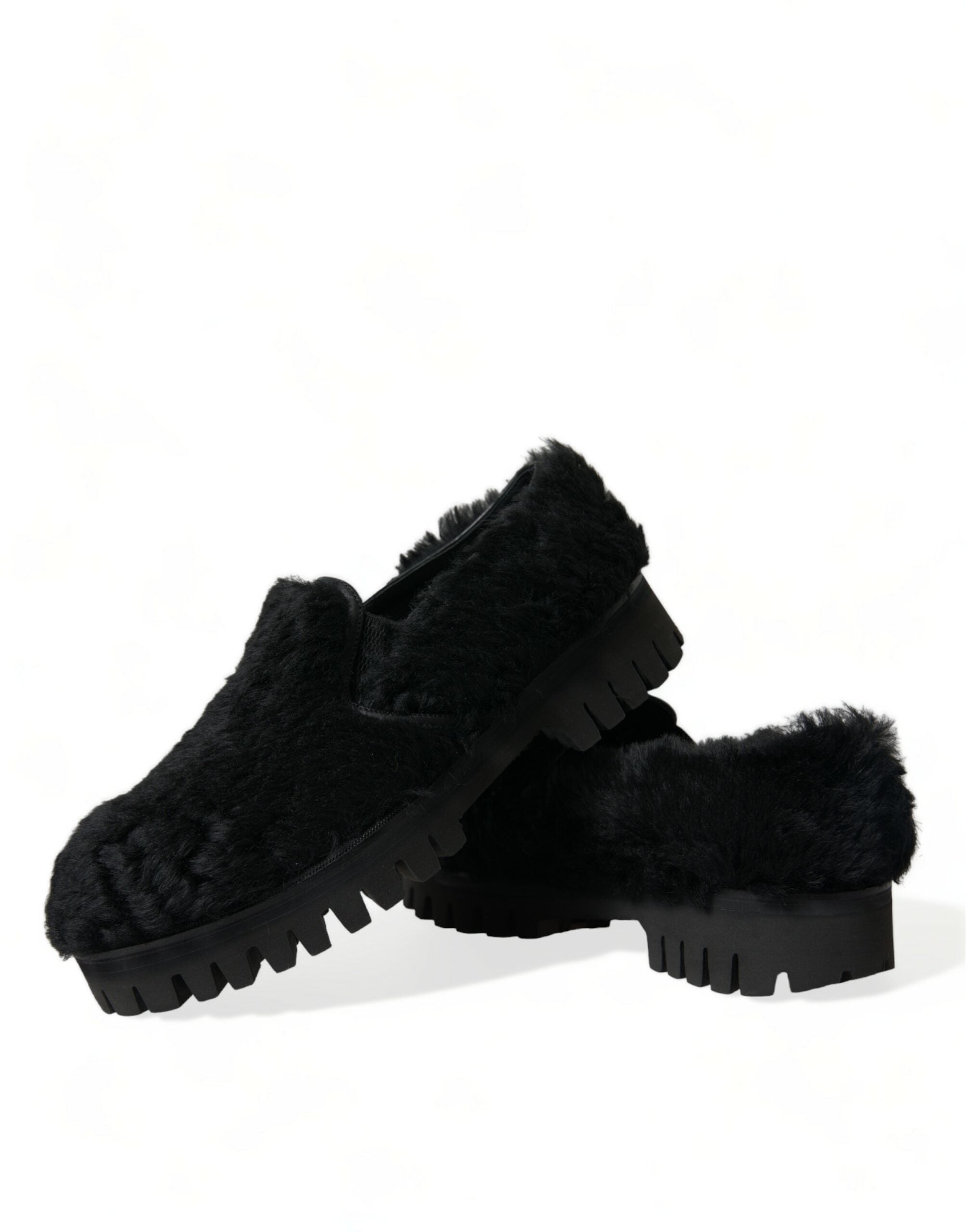 Black fur leather slippers dress shoes by Dolce & Gabbana, featuring sleek design and luxurious texture.
