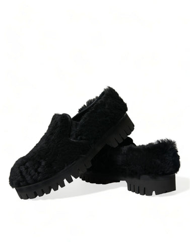 Black fur leather slippers dress shoes by Dolce & Gabbana, featuring sleek design and luxurious texture.