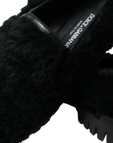 Black fur leather slippers dress shoes by Dolce & Gabbana with sleek design and luxurious fur accents.