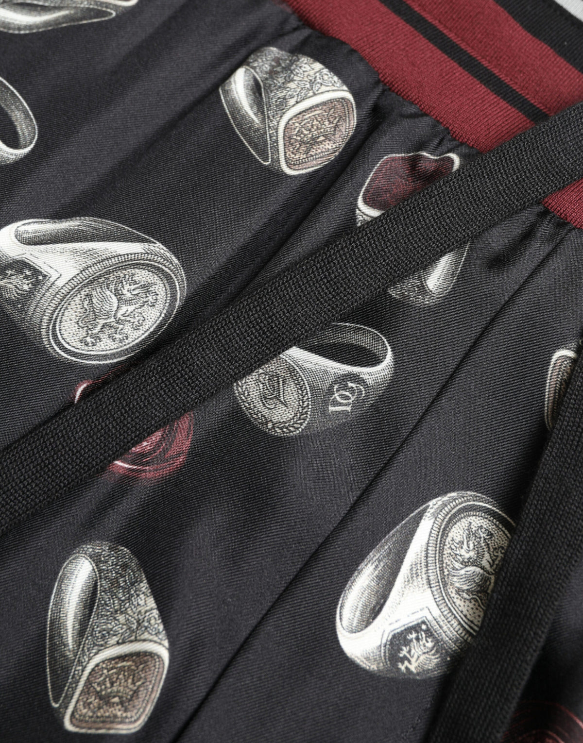 Black silk jogging trousers from Dolce & Gabbana featuring a relaxed fit and stylish design.
