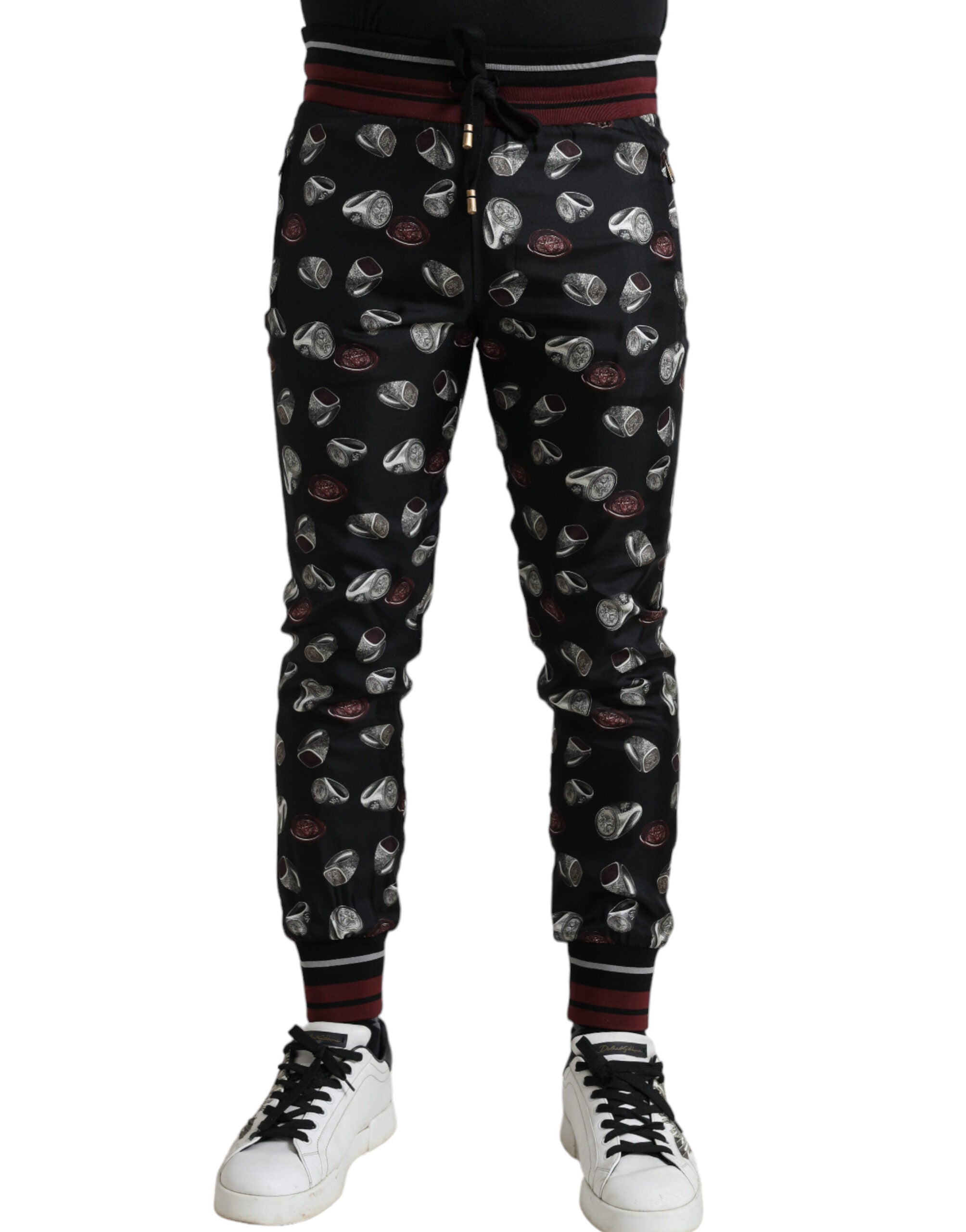 Black silk jogging trousers from Dolce & Gabbana featuring a relaxed fit and casual style for comfortable wear.