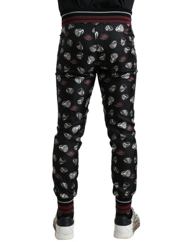 Black silk jogging trousers by Dolce & Gabbana featuring a relaxed fit and drawstring waistband, shown in the product image.