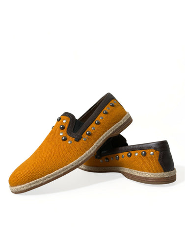 Orange linen leather studded loafers shoes by Dolce & Gabbana with a sleek slip-on design and decorative metal studs.