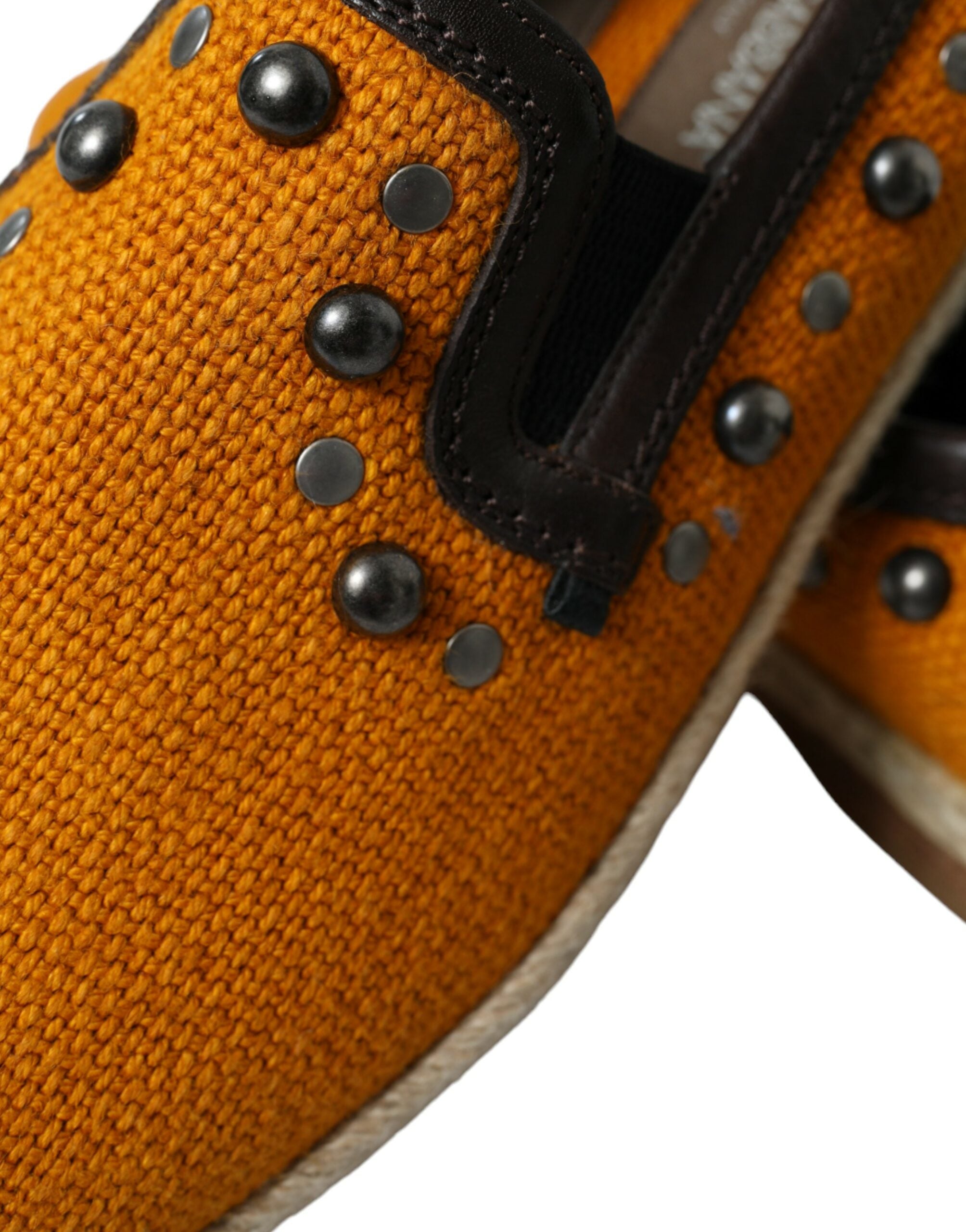 Orange linen leather studded loafers shoes by Dolce & Gabbana with metal stud accents, displayed on a neutral background.