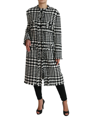 Black and white houndstooth trench coat jacket by Dolce & Gabbana, featuring classic design and tailored fit.