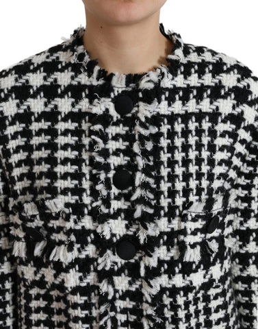 Black and white houndstooth trench coat jacket by Dolce & Gabbana, featuring classic design and tailored fit.