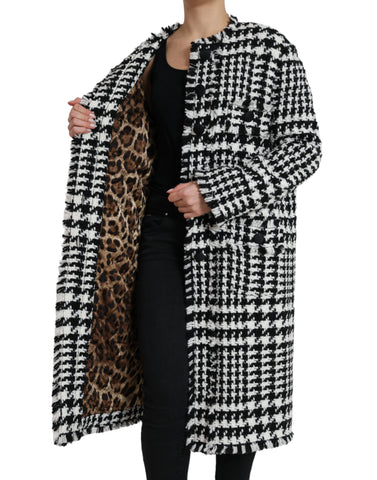 Black and white houndstooth trench coat jacket by Dolce & Gabbana, featuring classic design and tailored fit.