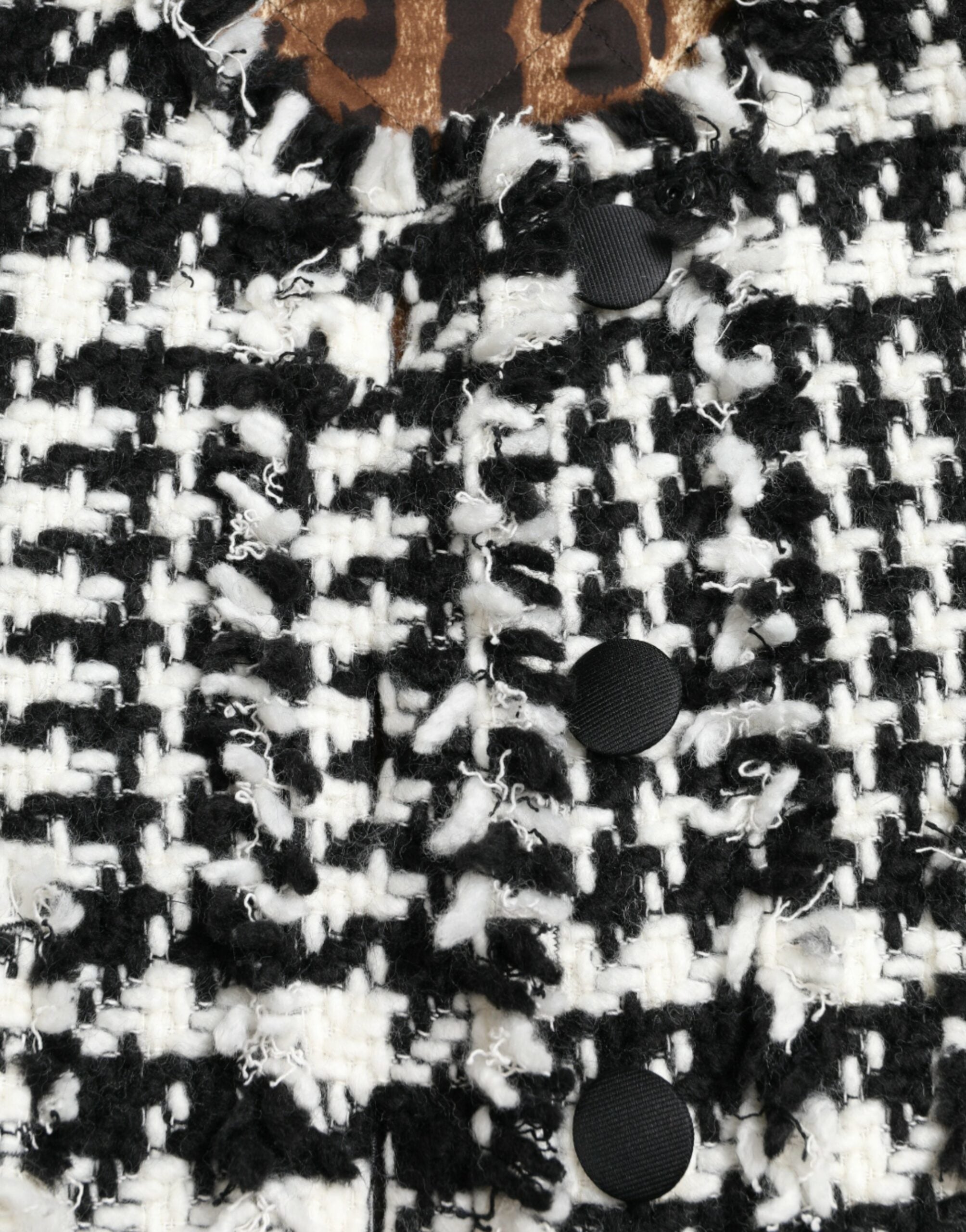 Black and white houndstooth trench coat jacket by Dolce & Gabbana, featuring classic design and stylish fit.