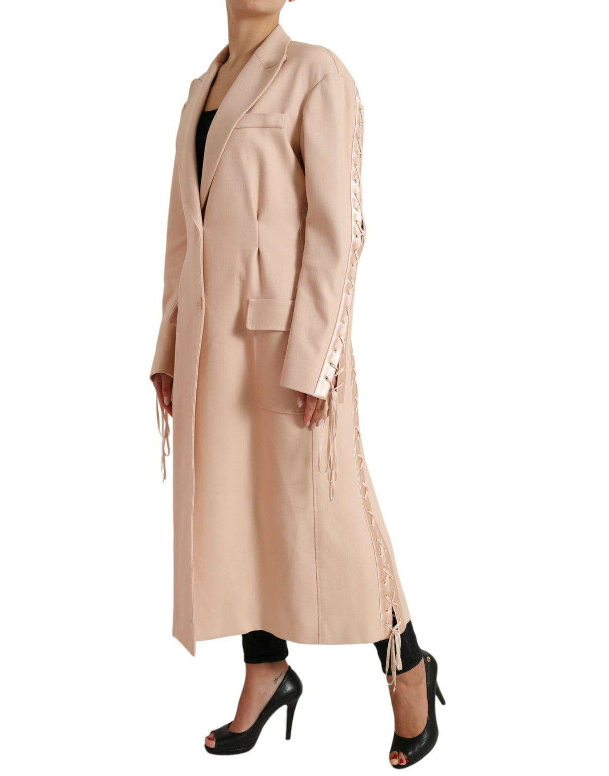 Beige cotton long coat jacket with single breasted design from Dolce & Gabbana, shown on a hanger.