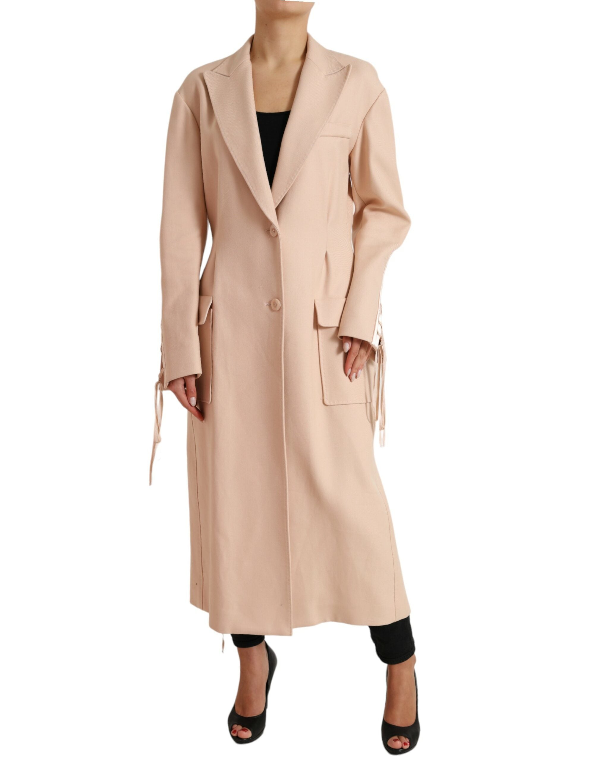 Beige cotton single-breasted long coat jacket by Dolce & Gabbana, displayed on a hanger with a tailored fit and classic lapel design.