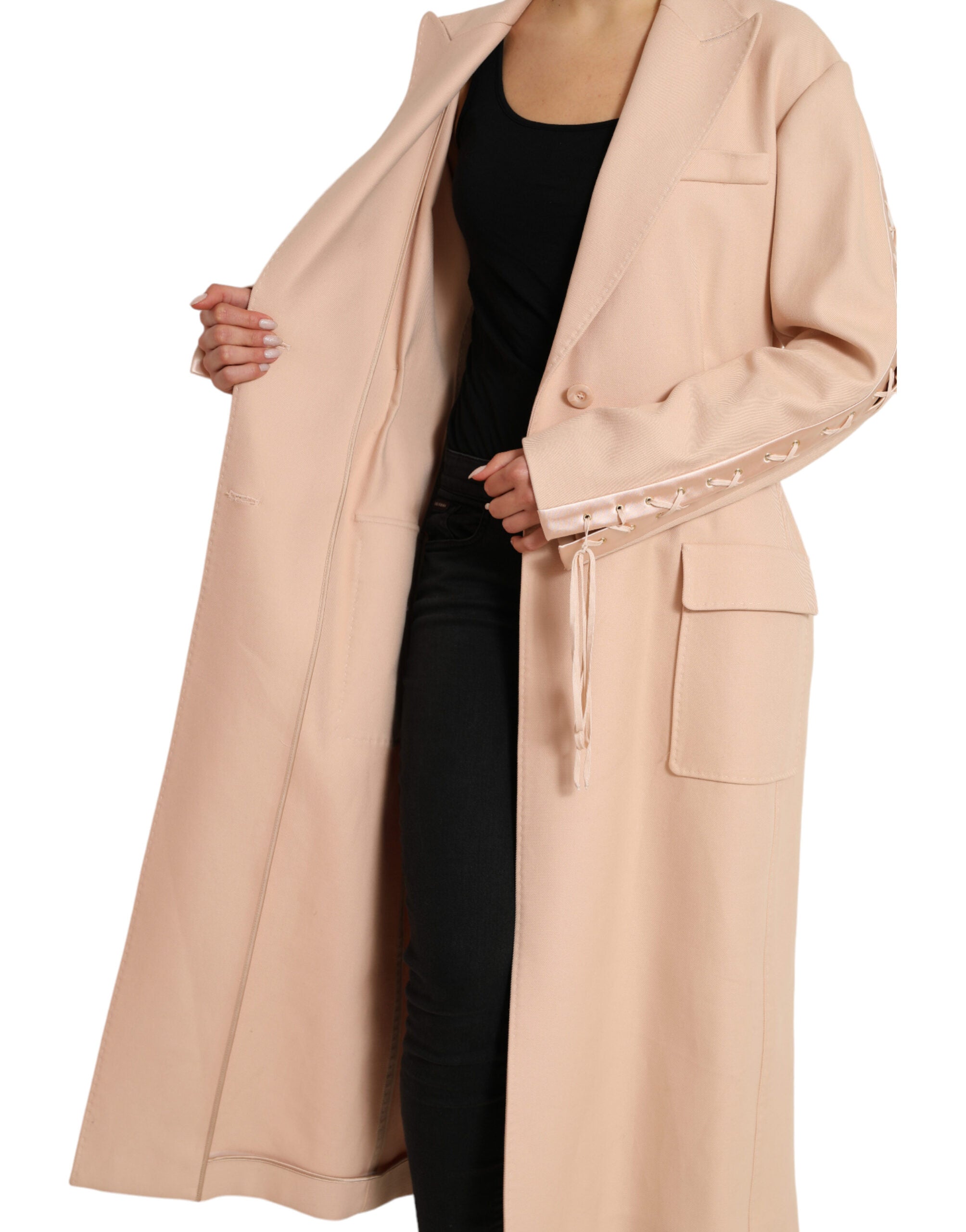 Beige cotton long coat jacket with single-breasted design from Dolce & Gabbana, displayed on a hanger.