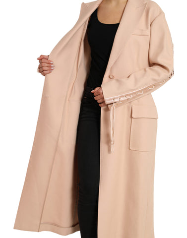 Beige cotton long coat jacket with single-breasted design from Dolce & Gabbana, displayed on a hanger.