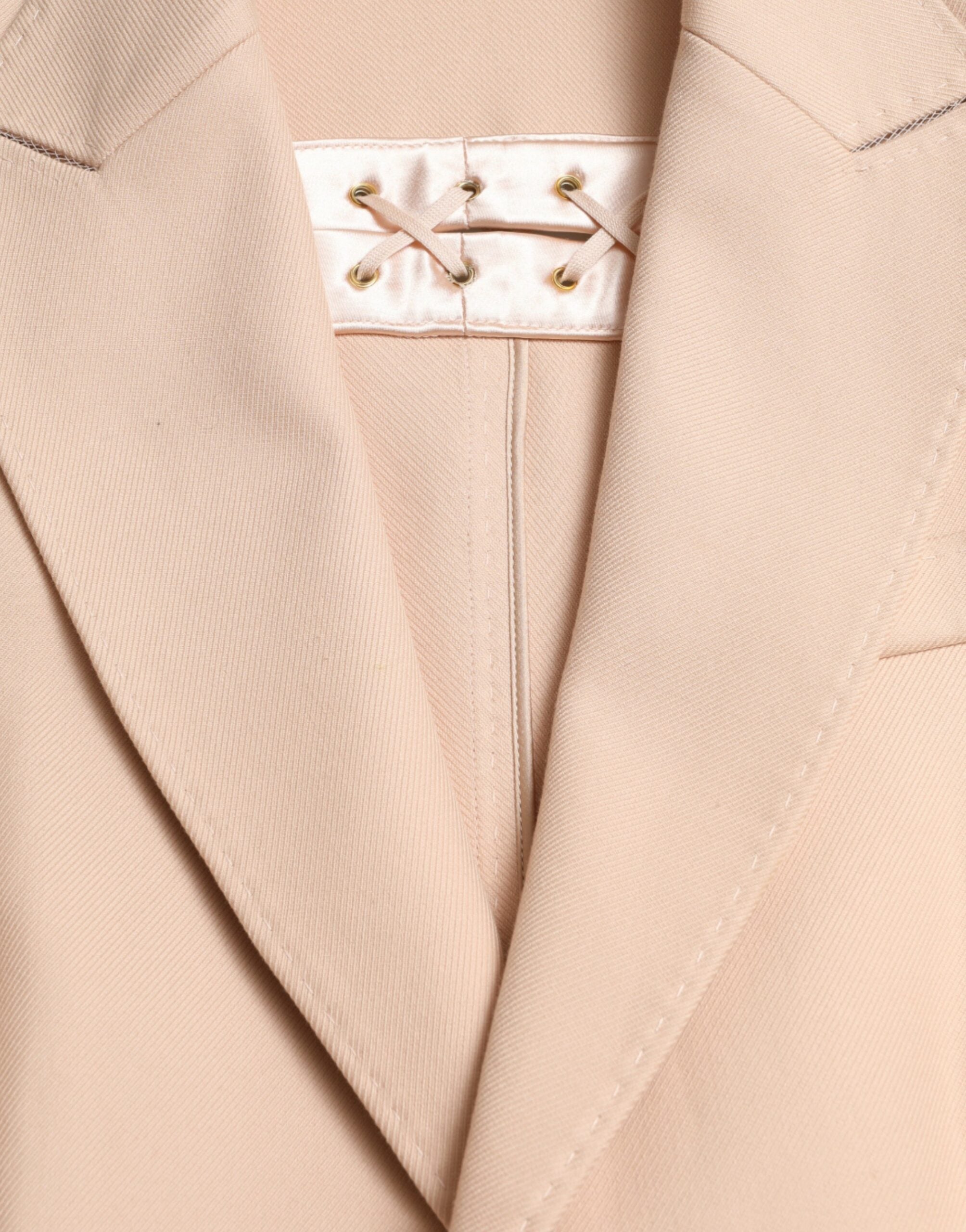 Beige cotton single-breasted long coat jacket by Dolce & Gabbana, showing tailored design and classic collar detail.