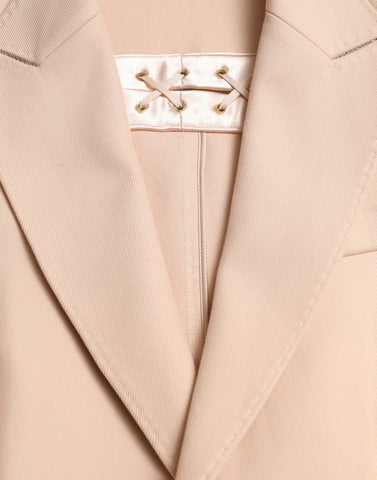 Beige cotton single-breasted long coat jacket by Dolce & Gabbana, showing tailored design and classic collar detail.