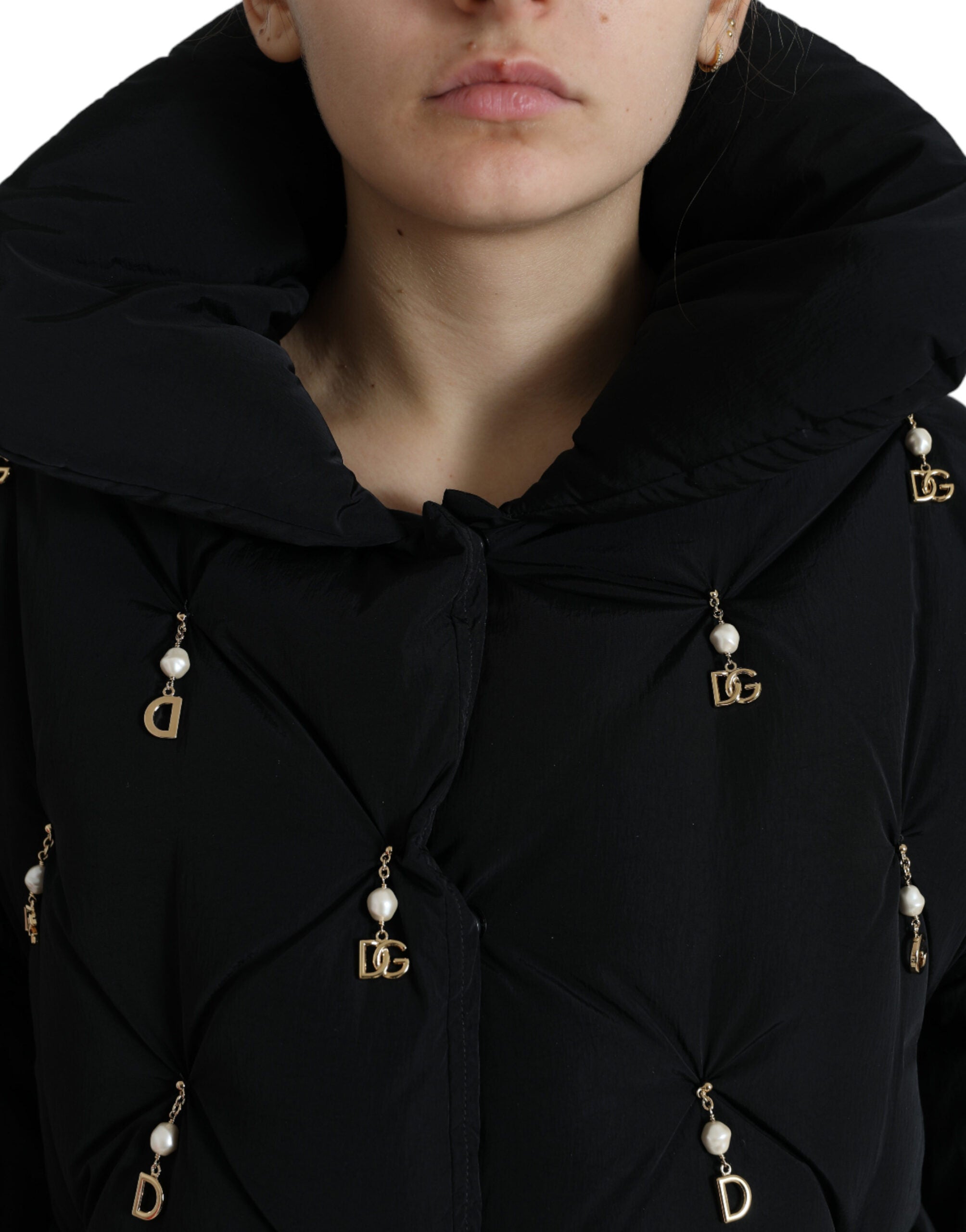 Black embellished quilted shell bomber jacket by Dolce & Gabbana featuring intricate embroidery and a fitted design.