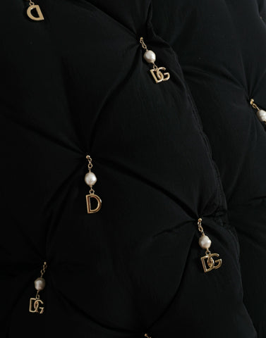 Black quilted shell bomber jacket with embellishments by Dolce & Gabbana, featuring a fitted design and decorative details.