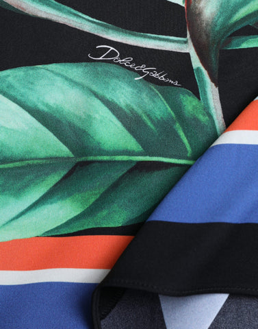 Black Strelitzia high waist wrap midi skirt by Dolce & Gabbana, featuring elegant design and flowing fabric.