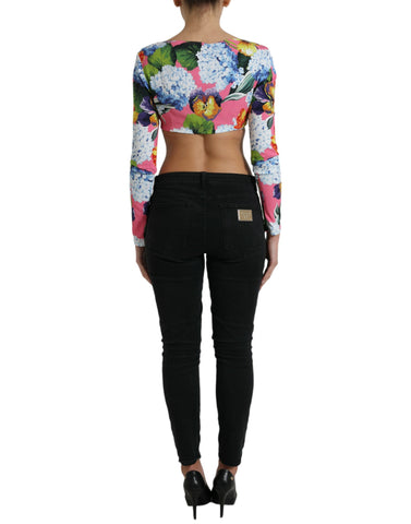 Multicolor floral long sleeve cropped top by Dolce & Gabbana, featuring vibrant floral pattern and fitted design.