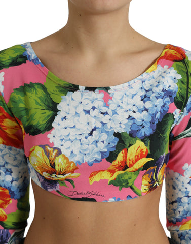 Multicolor floral long sleeve cropped top by Dolce & Gabbana with vibrant flower patterns and fitted design.
