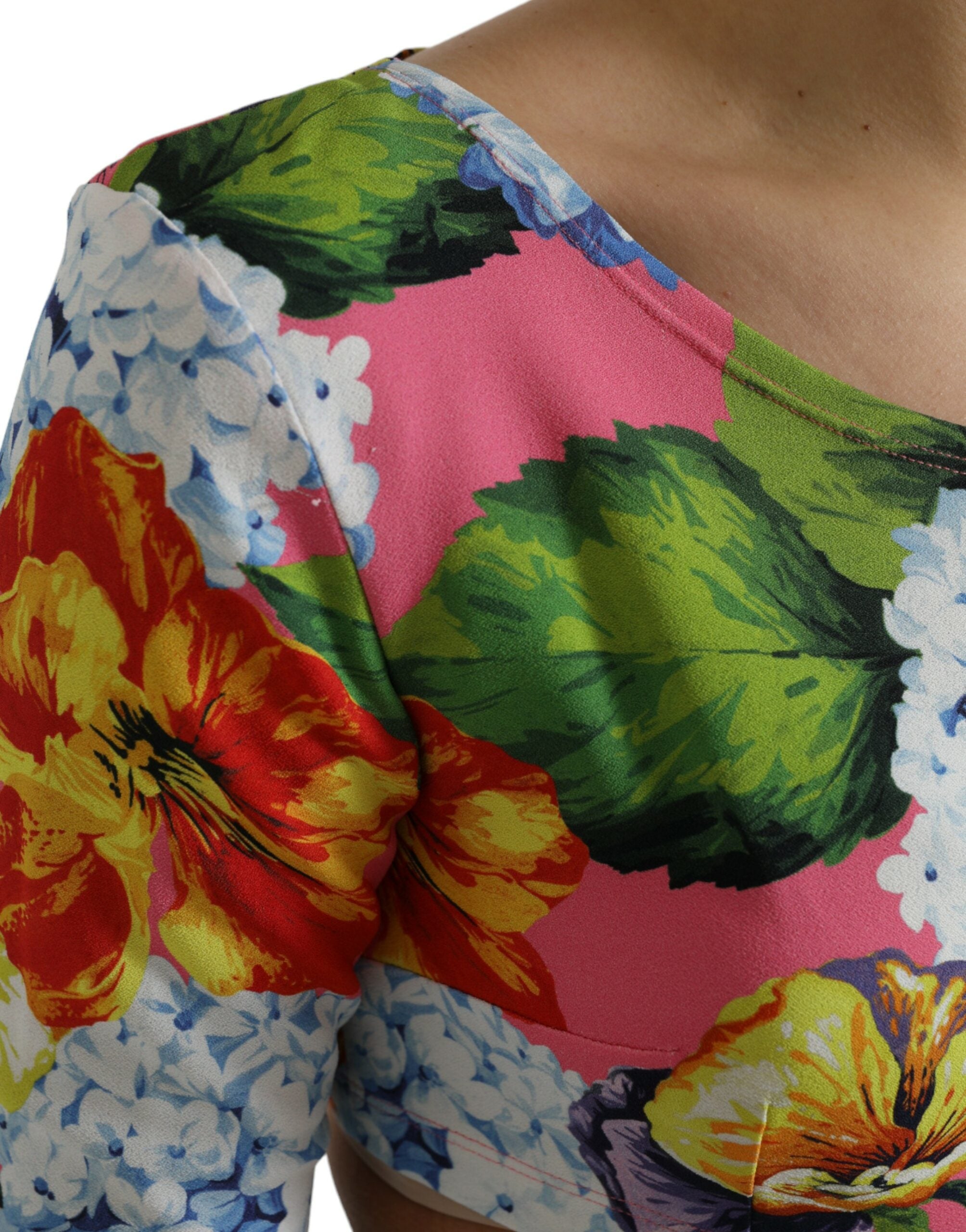Multicolor floral long-sleeve cropped top by Dolce & Gabbana, featuring vibrant floral patterns and fitted design.