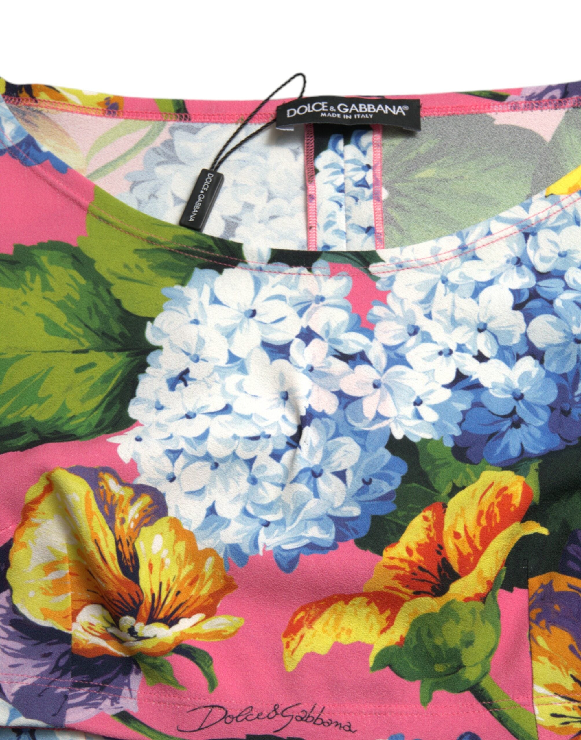 Multicolor floral long-sleeve cropped top by Dolce & Gabbana, featuring vibrant floral pattern and fitted design.