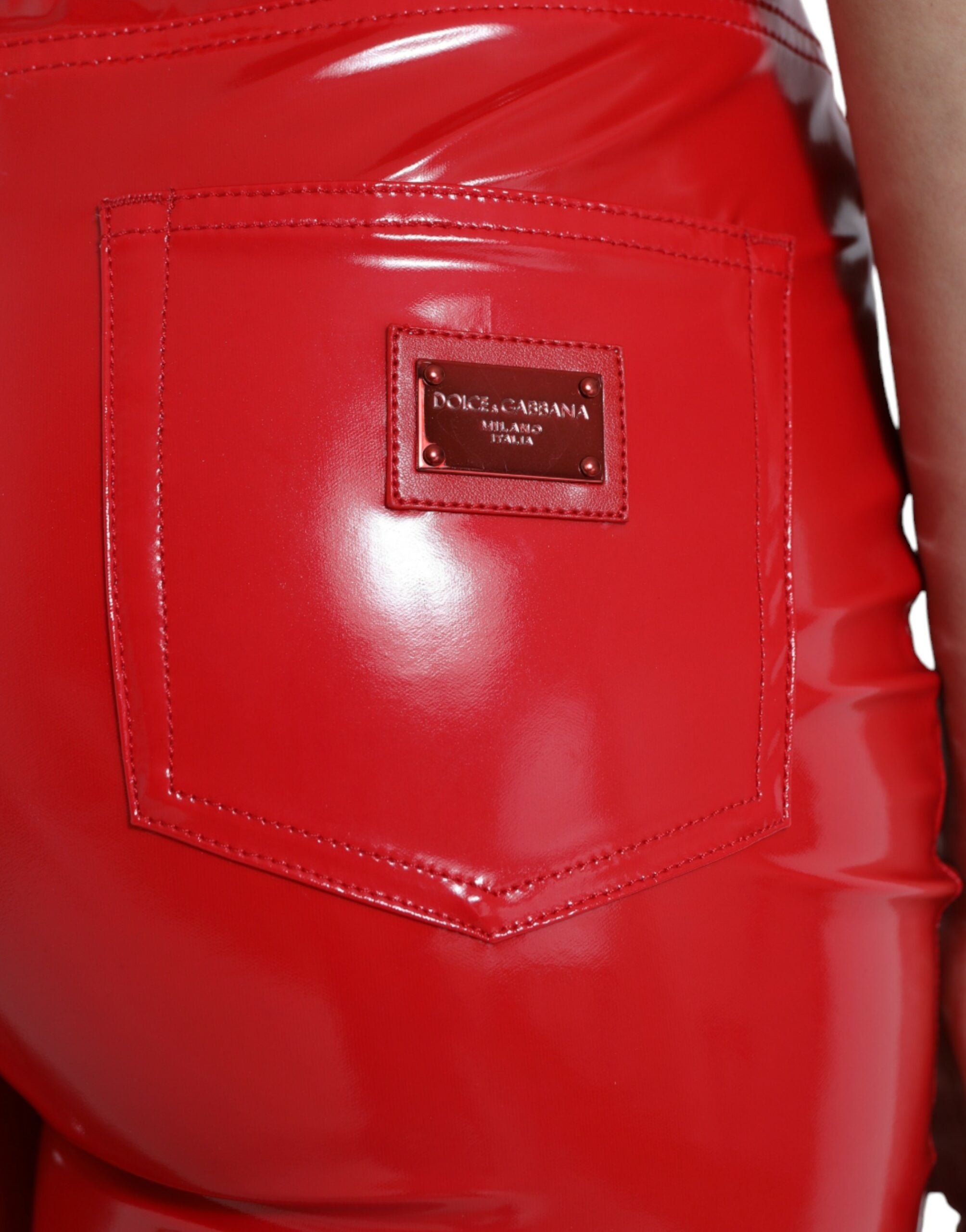 Shiny red high-waist skinny pants by Dolce & Gabbana, fitted design with sleek fabric and stylish appearance.