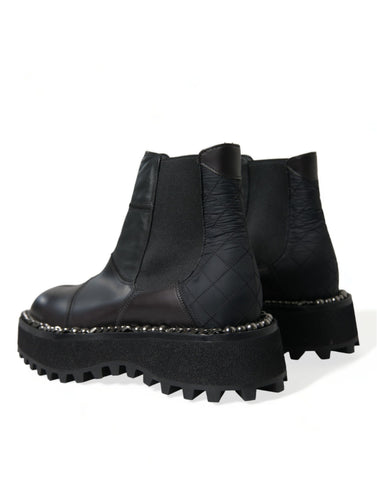Black leather slip-on Chelsea boots by Dolce & Gabbana, featuring stretch panels for a sleek and comfortable fit.