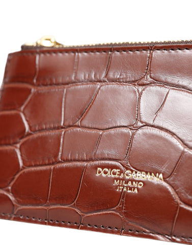Brown alligator leather AirPods case, coin purse, and wallet by Dolce & Gabbana, featuring a compact, luxurious accessory design.