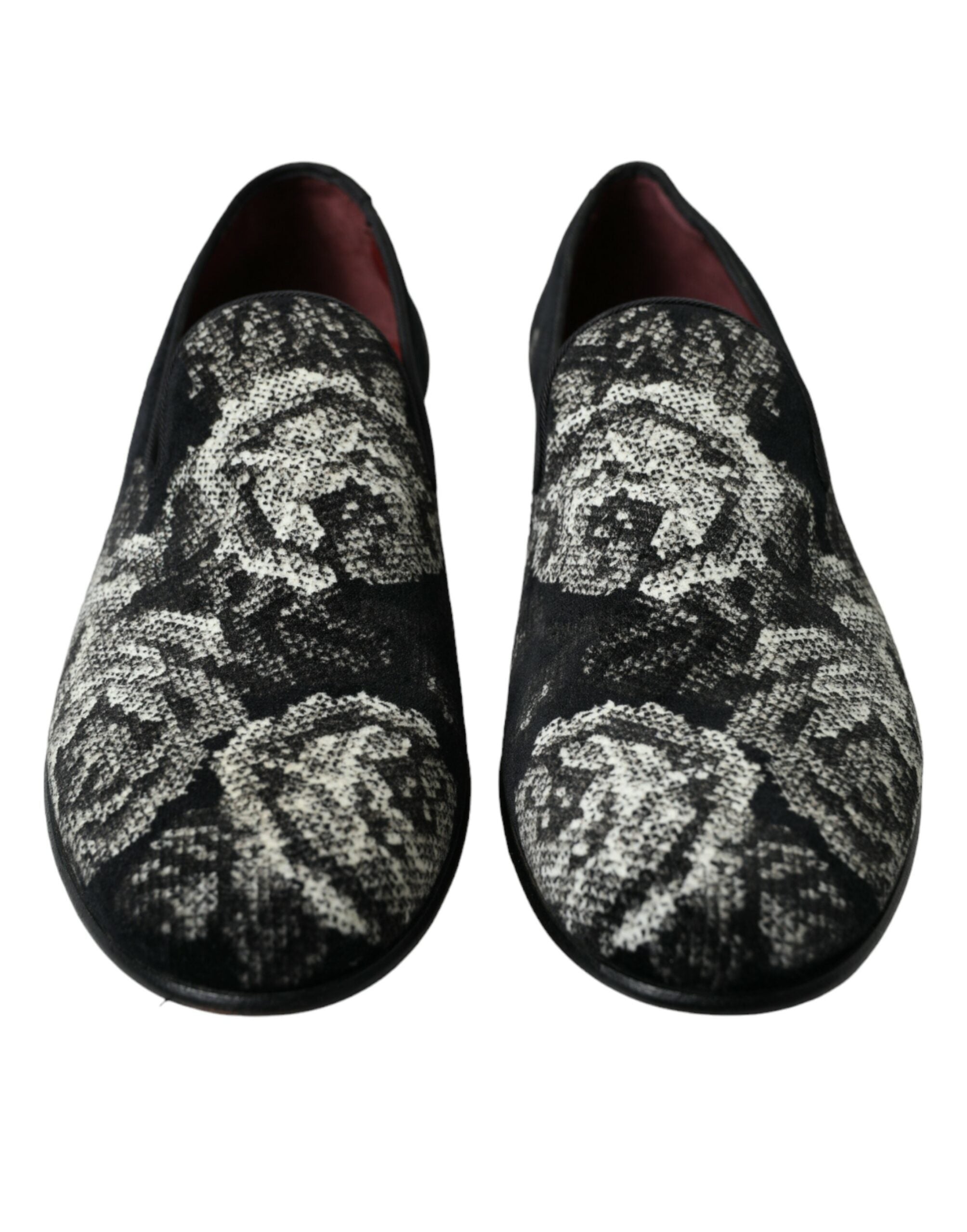 Black floral Dolce & Gabbana men's loafers with slip-on design and dress shoe style, featuring floral pattern accents.