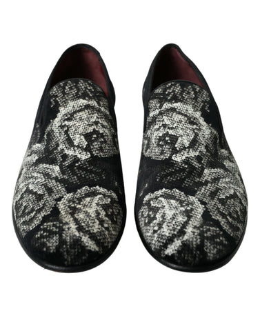 Black floral Dolce & Gabbana men's loafers with slip-on design and dress shoe style, featuring floral pattern accents.