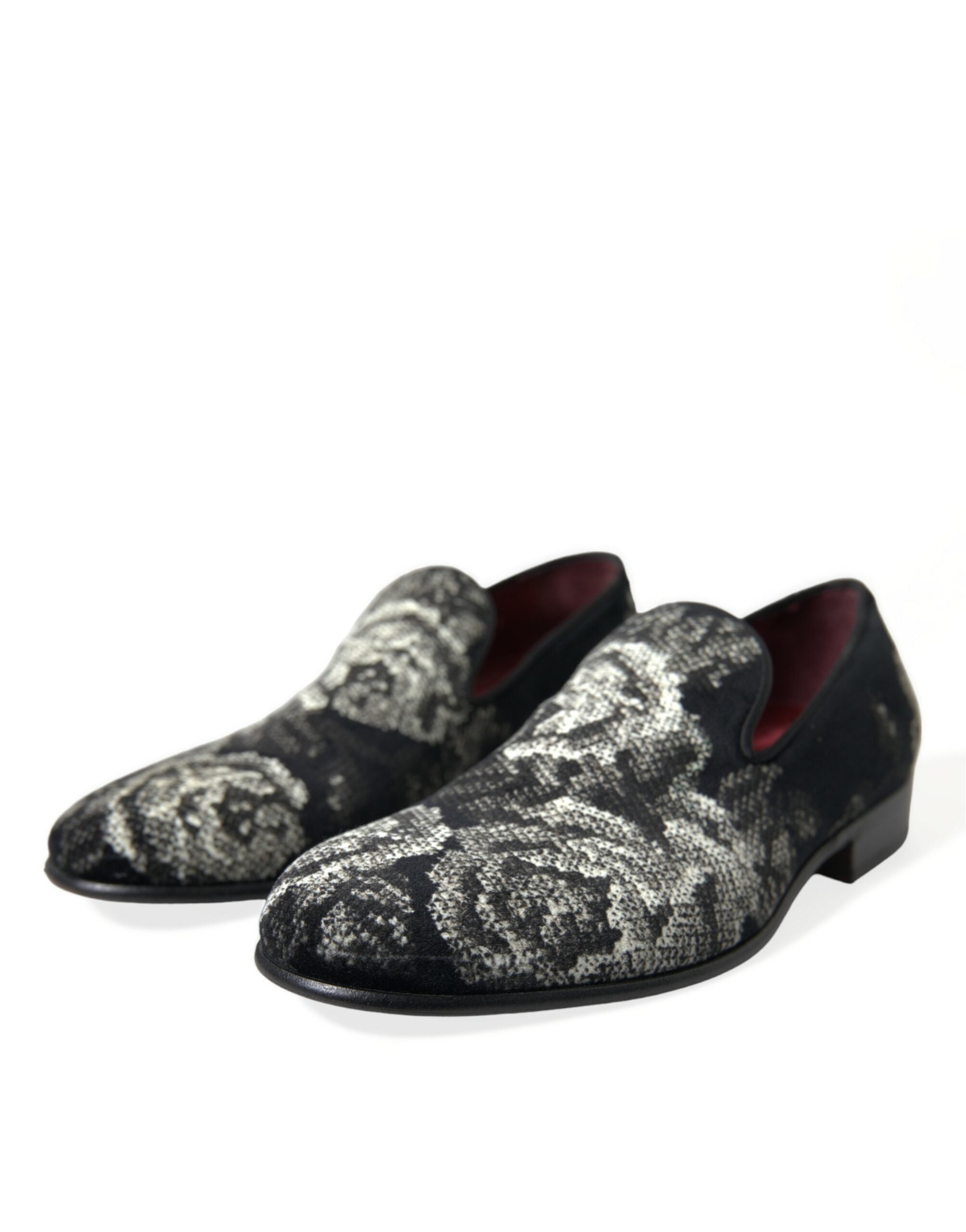 Black floral slip-on loafers for men by Dolce & Gabbana, featuring stylish floral patterns and dress shoe design.