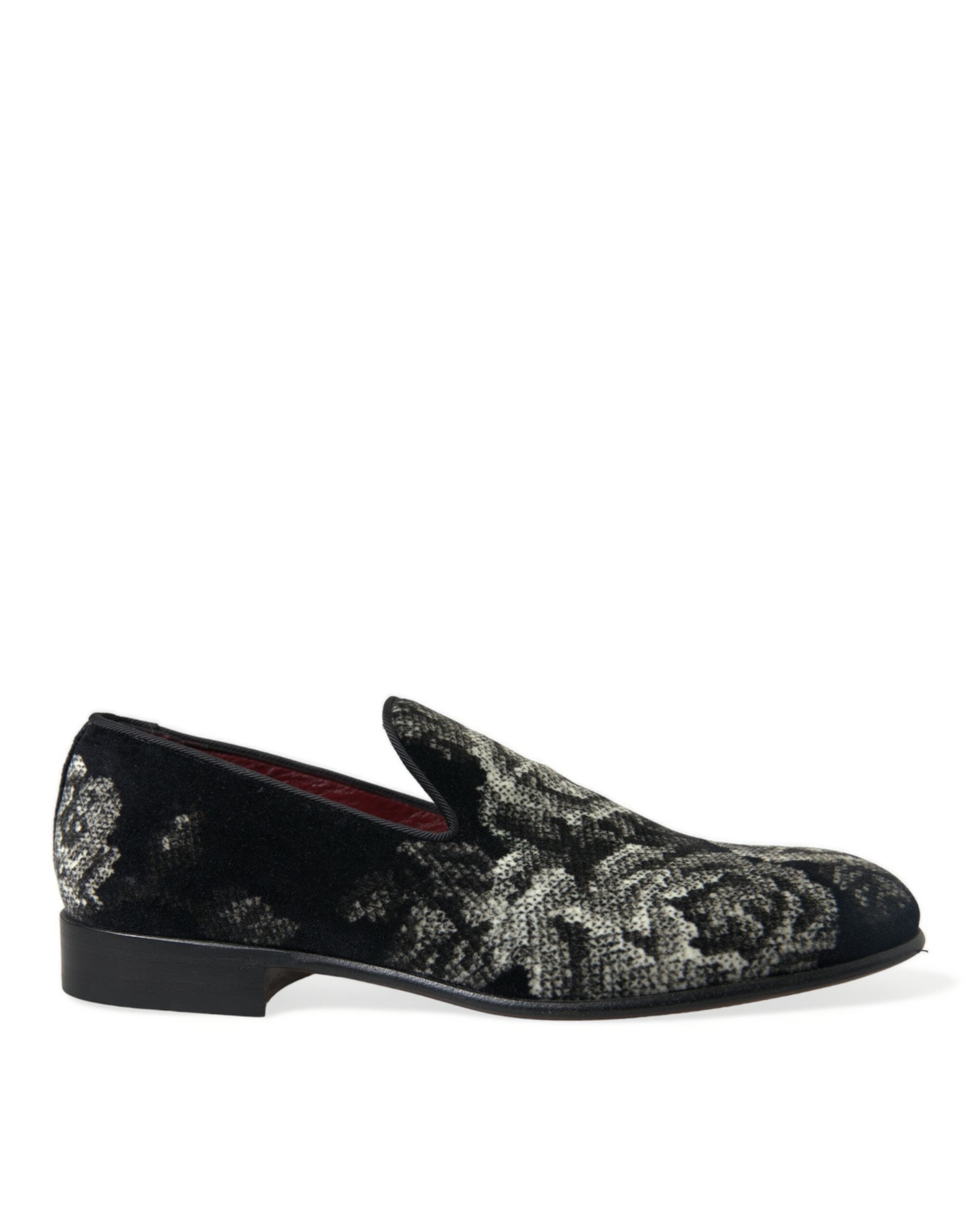 Black floral men's loafers by Dolce & Gabbana featuring stylish slip-on design and floral pattern detail.