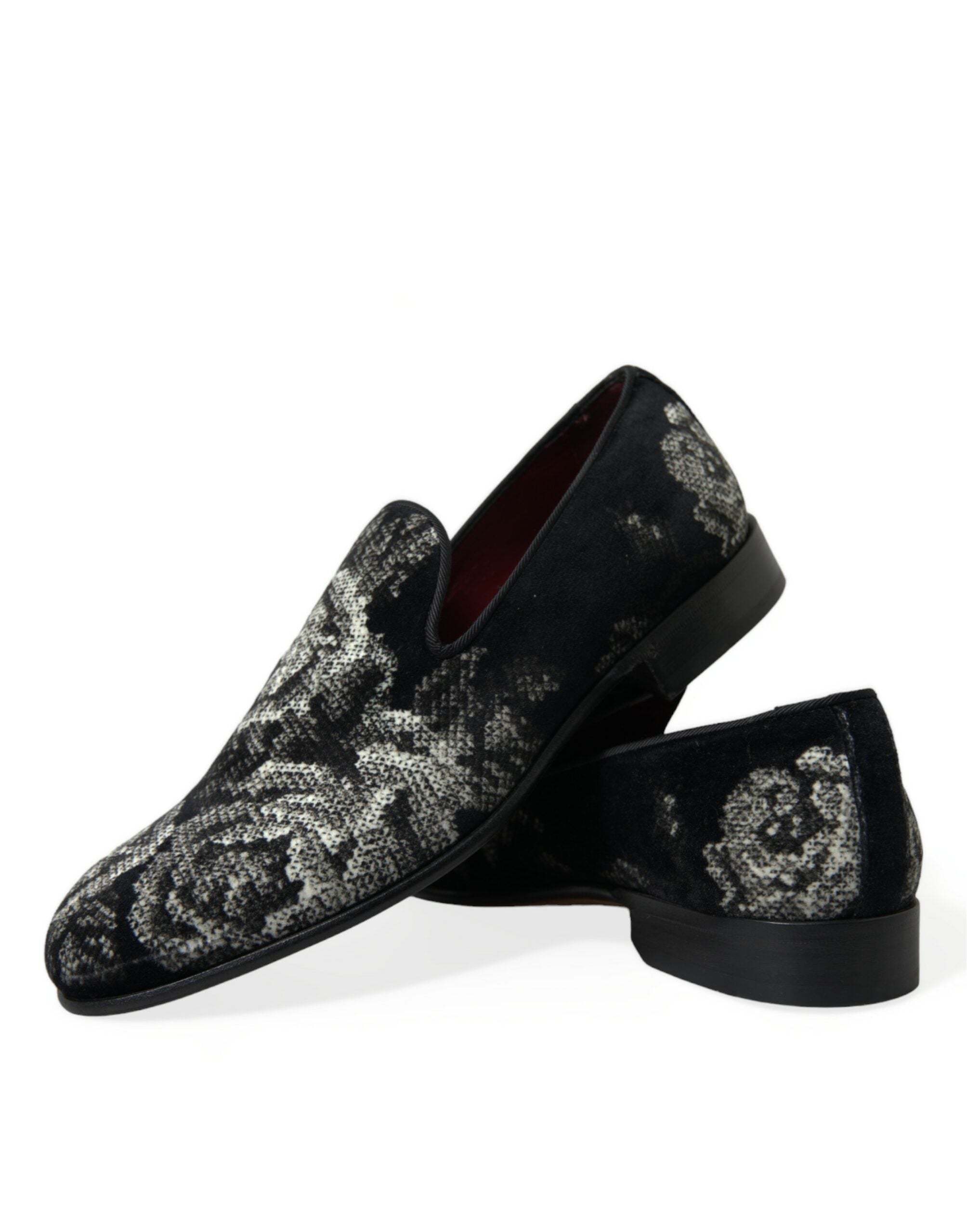 Black floral Dolce & Gabbana men's loafers with slip-on design and dress shoe style, featuring floral pattern details.