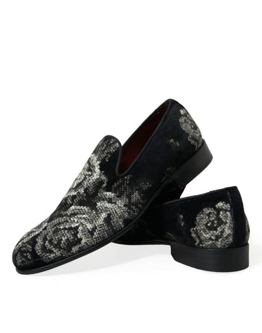 Black floral Dolce & Gabbana men's loafers with slip-on design and dress shoe style, featuring floral pattern details.