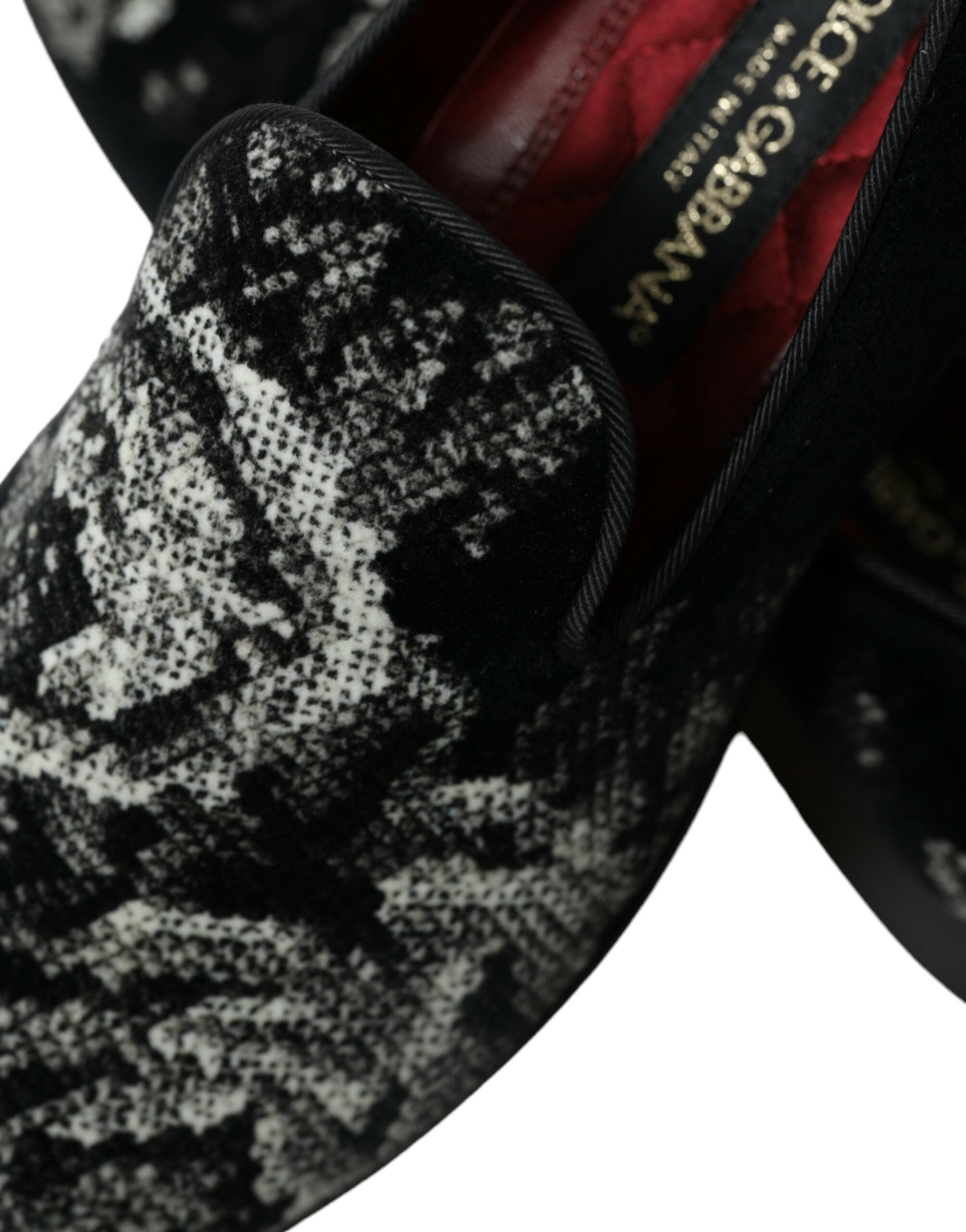 Black floral Dolce & Gabbana men's slippers loafers with dress shoe style and floral pattern, casual elegant footwear.