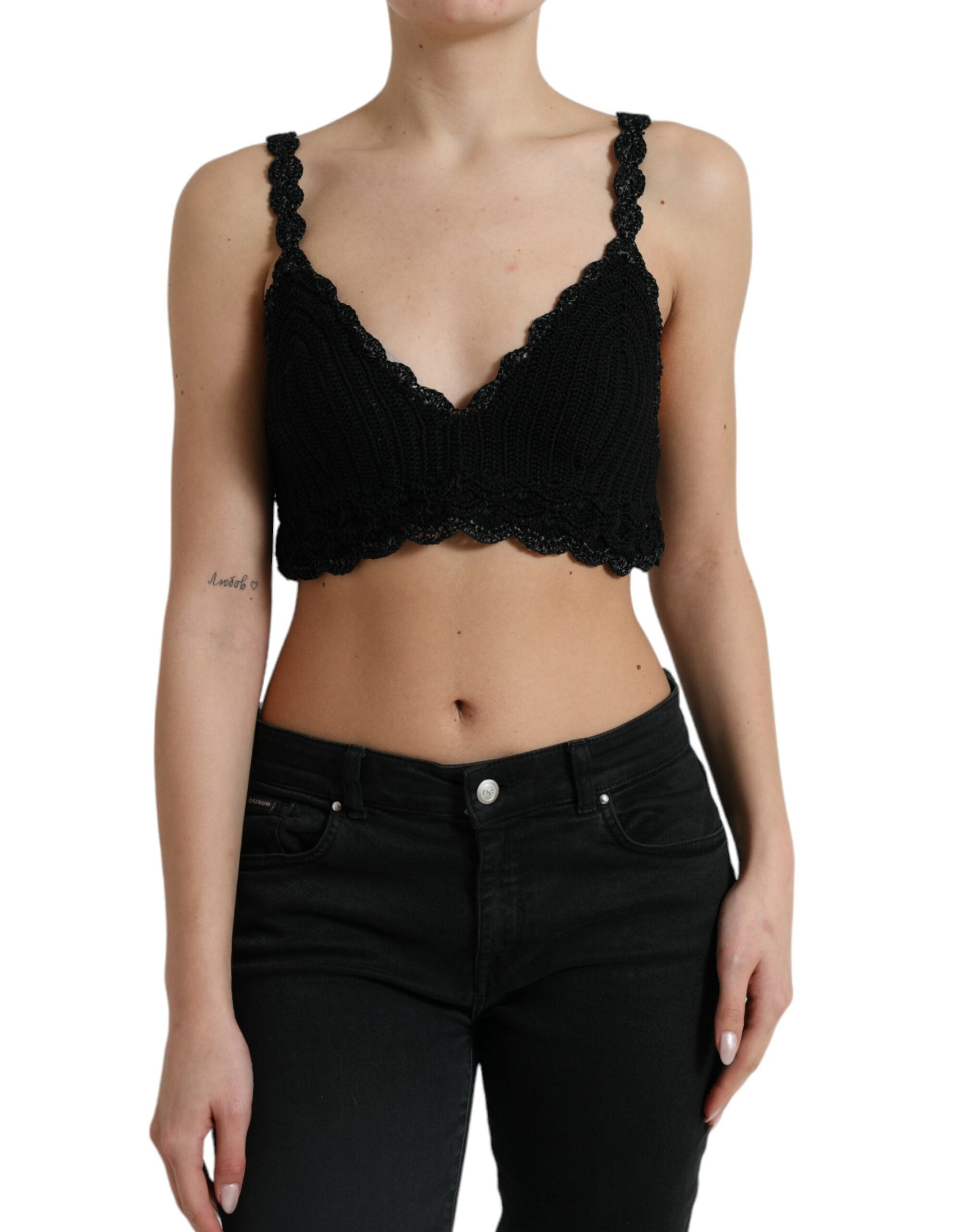 Black cotton bustier cropped crochet tank top by Dolce & Gabbana, showing detailed knit fabric and fitted design.