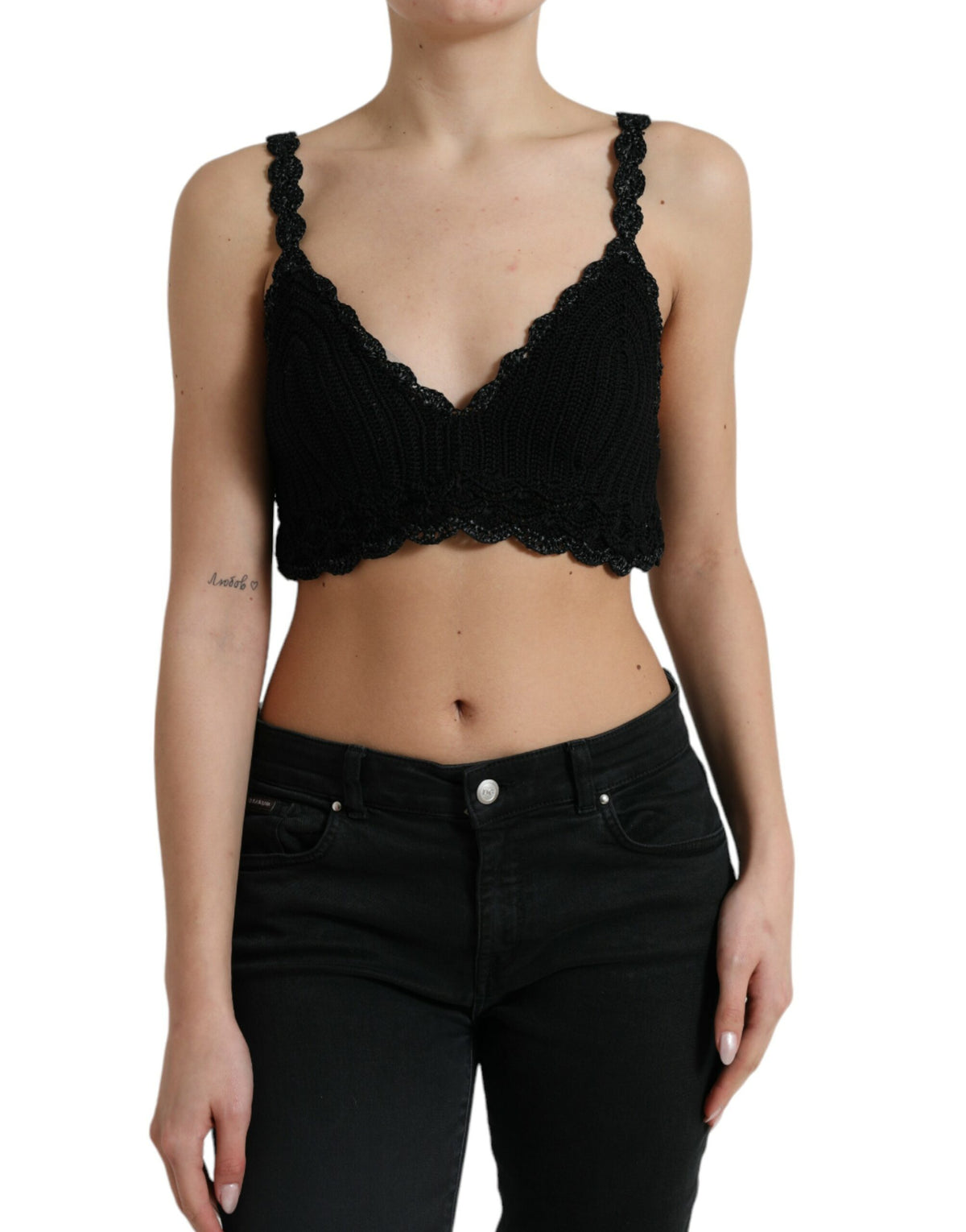 Black cotton bustier cropped crochet tank top by Dolce & Gabbana, showing detailed knit fabric and fitted design.