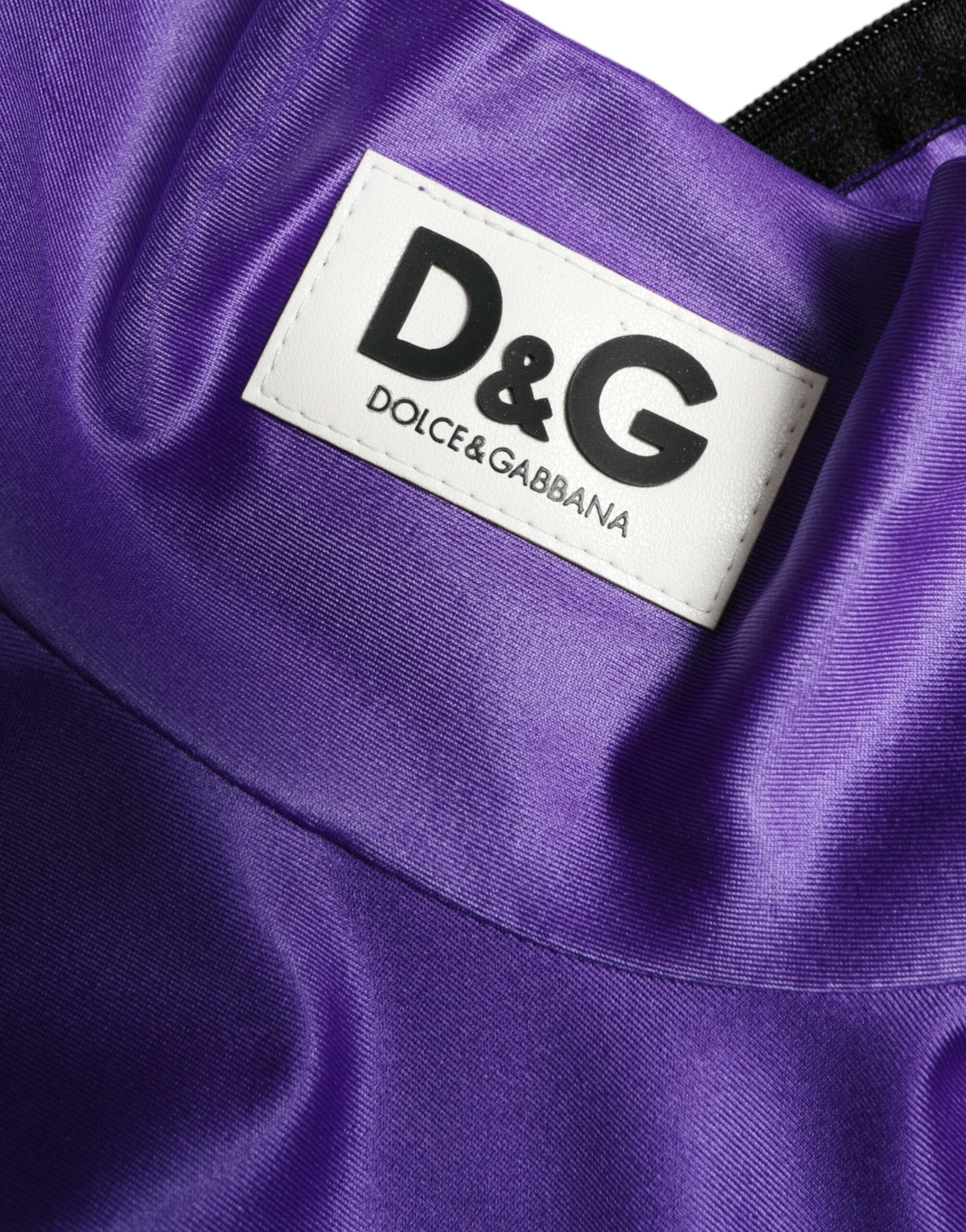 Purple nylon stretch slim long sleeve top by Dolce & Gabbana, close-up of fitted fabric and sleek design.