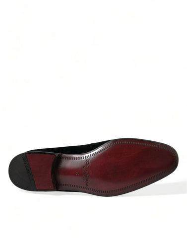 Black velvet loafers by Dolce & Gabbana, formal dress shoes with sleek design and classic slip-on style.