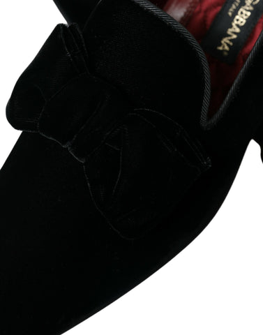 Black velvet loafers by Dolce & Gabbana, formal dress shoes with sleek design and classic slip-on style.