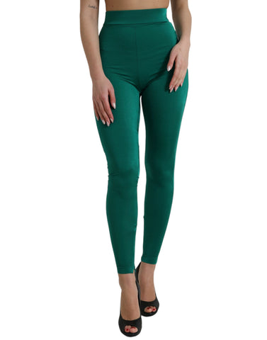 Green nylon stretch slim legging pants by Dolce & Gabbana, showing a close-up of the fitted, sleek design and smooth fabric.