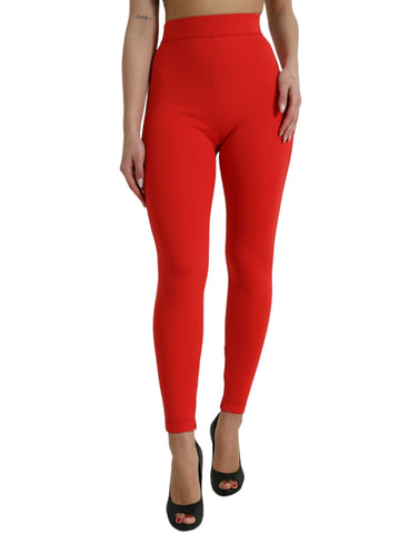 Red nylon stretch slim leggings by Dolce & Gabbana, close-up of fitted, high-waisted pants showing smooth fabric and sleek design.