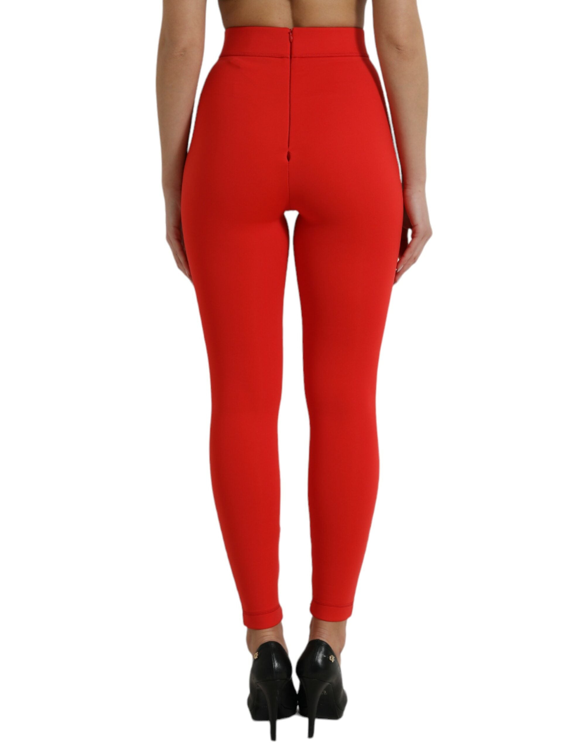 Red nylon stretch slim leggings pants by Dolce & Gabbana displayed on a model, showcasing a fitted, sleek design.